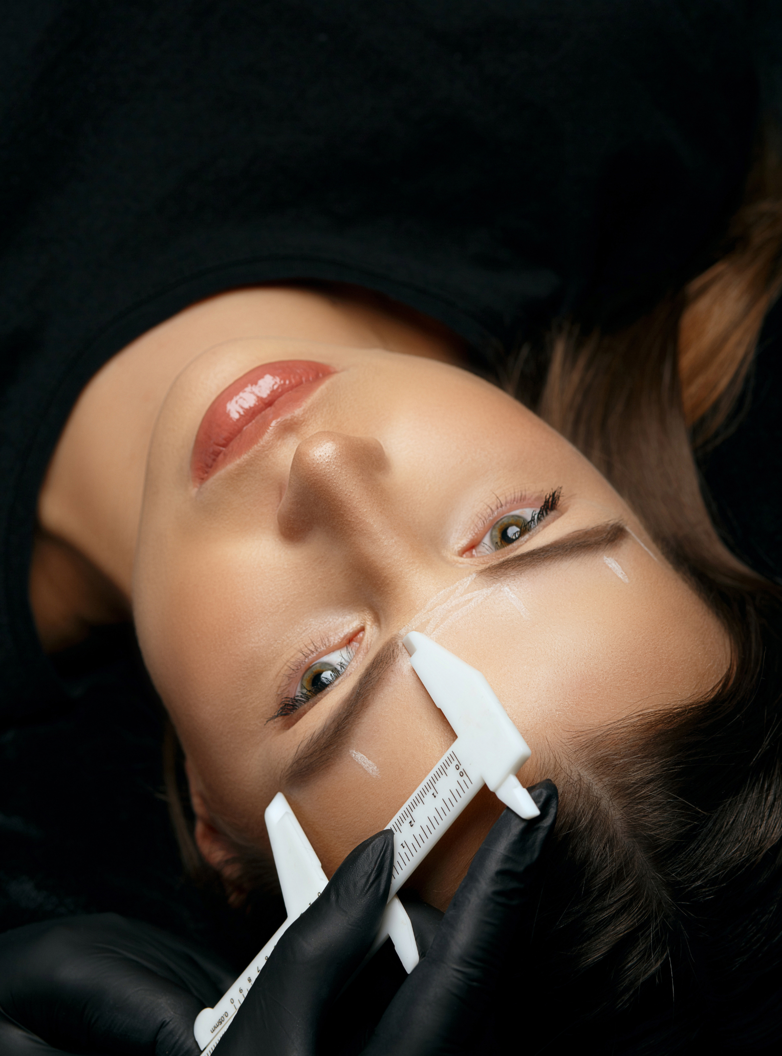 Measuring eyebrows with a ruler, eyebrow makeup